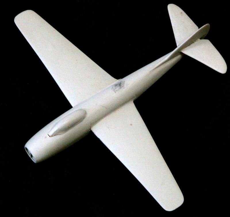 POST WAR MIG 9 JET FIGHTER BRITISH ID MODEL PLANE: Maker: British ID model. MIG 9 Russian Jet Fighter, 1950. Used by the Soviet Air Forces and the People's Liberation Army. Painted grey, wingspan is 7.75 inches. Minor cracking at creases, overall good