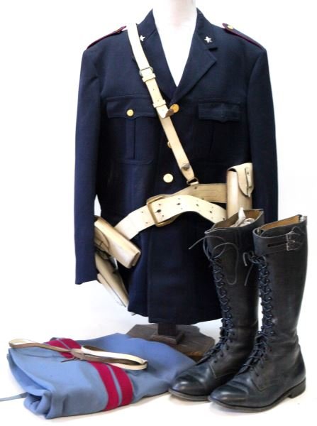 ITALIAN MOTORCYCLIST TRAFFIC POLICE UNIFORM: Post World War II Italian state police uniform for the department of traffic. This uniform includes tunic, trousers, boots, whistle lanyard, and belt with holster and ammunition cases. The tunic has a