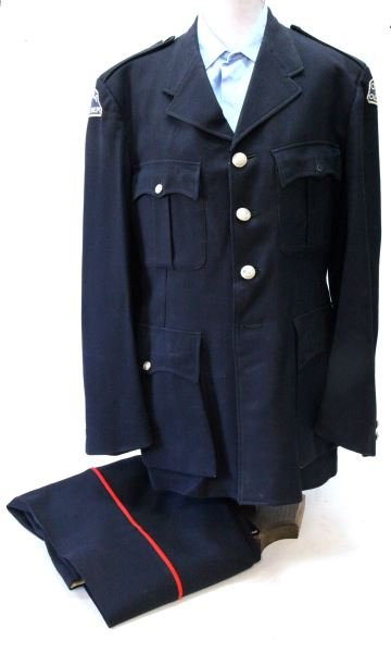 CANADA ORILLIA CITY POLICE DEPARTMENT UNIFORM: Post World War II police uniform. The uniform consists of a tunic, shirt and trousers. The item is free from mothing. The tunic has Orillia Police Department badges, and buttons with insignia. The tun