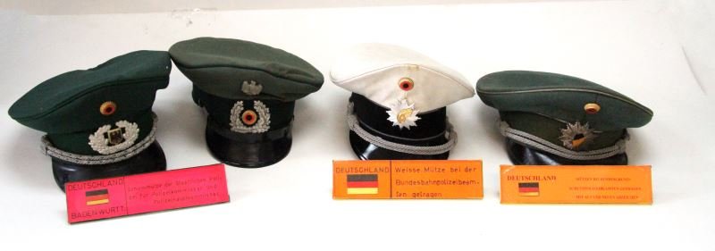 WORLD MUSEUM GERMAN POLICE HATS VISORS LOT OF 4: 4 German police hats, Mid 20th Century. Includes visors of the State police, Commissioner General, Nationwide cross protection police, and Federal Highway police. Insignia to front center, chinstraps 