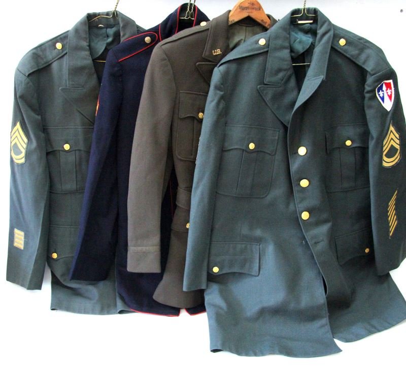 WWII TO VIETNAM USMC MARINE & US ARMY UNIFORM LOT: Includes a size 46, first SGT. tunic, 1944 pattern USMC dress blues size 36 uniform, post war artillery U.S. Army uniform, and a Vietnam era 1ST SGT. uniform all very good.