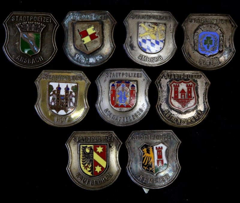 9 GERMAN PINBACK POLICE BADGE LOT STADTPOLIZEI: All different 1 3/4 inch badges all with pinbacks, early post war, from the World Police Museum, Milan, Italy and is accompanied with COA.