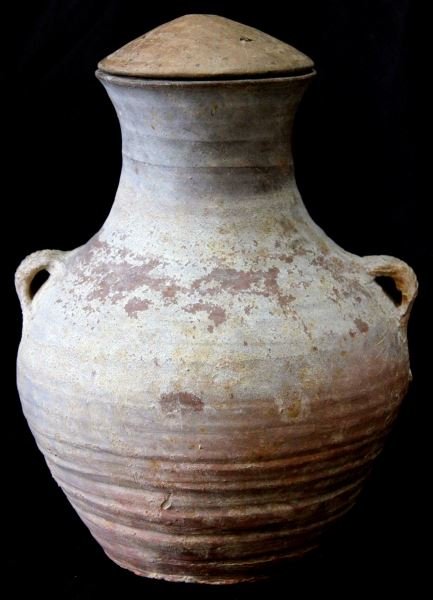 GREY TERRACOTTA HAN DYNASTY LIDDED VESSEL: Grey finish over terracotta clay with two small imprinted handles. Dated to Han Dynasty (206 BC - 220 AD). Lidded jar measures around 12 inches, 4.5 inch rim diameter and 8 inch diameter at widest poi