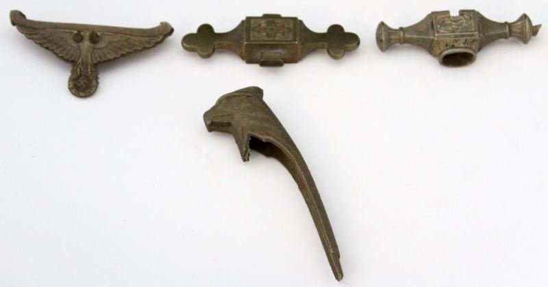 FOUR MISCELLANEOUS RAW UNFINISHED DAGGER PARTS: Miscellaneous parts include one pommel and three cross guards. In brass and being unpolished, included is an eagle head pommel, a Navy, Fire and Army cross guards. This lot has a reserve.