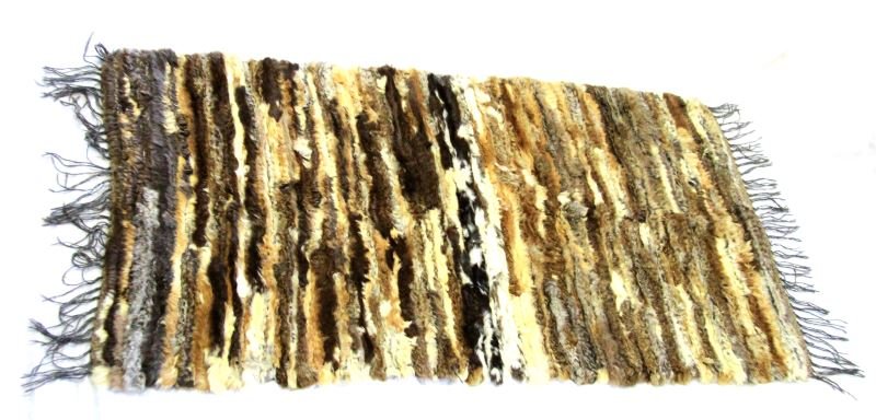 ANTIQUE RABBIT FUR HIDE QUILT 33 BY 51 INCHES: Rabbit fur blanket or rug. Pieced together by many different rabbits. and has fur on both sides. This type of blanket was popular with native tribes in California. Overall very good condition. 33 by 5