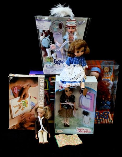 LOT OF DOLLS NEW IN BOX INCLUDING BRATZ DOLL: This lot includes seven items all in box. In this lot we have a What's Her Face, Trip Itz, Bratz, an It's Me, Flip and Fold Fashions doll and two others. The "It's Me!" doll by the Family Company is t
