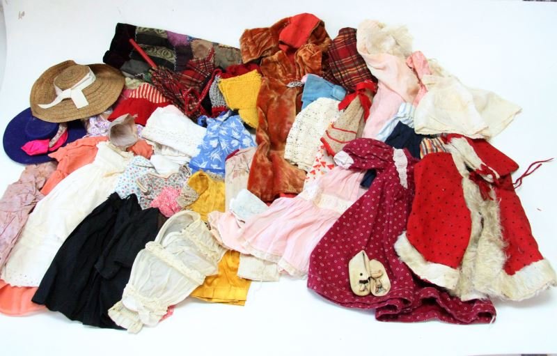 LARGE UNSEARCHED LOT OF ANTIQUE DOLL CLOTHING: Large unsearched doll clothing lot. From the surface it appears to have antique and vintage doll clothes. The doll clothing also appears to be in a variety of sizes. Conditions range from good to very