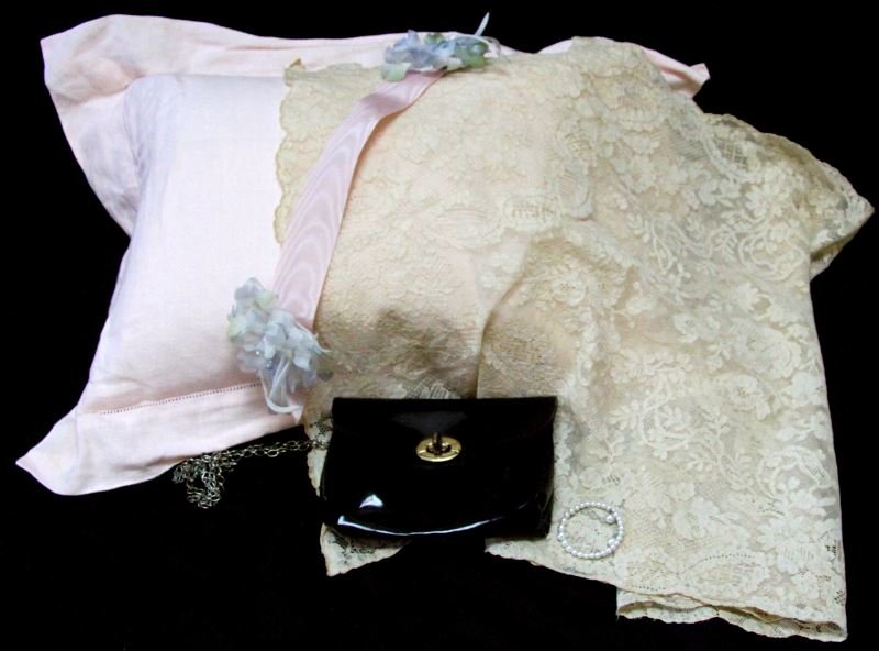 VINTAGE DOLL ACCESSORY PILLOW PURSE LACE BRACELET: Vintage doll accessory lot. Includes pillow with linen cover, patent leather black purse, lace blanket, and white bracelet. Good vintage condition. From the Jeryl Matlock Doll & Toy Collection. 0