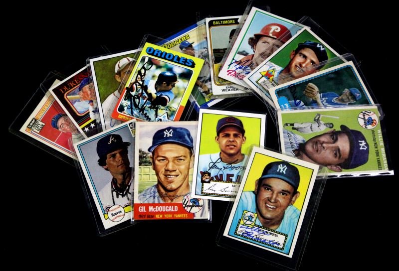 14 SIGNED BASEBALL CARDS FROM 1950'S TO 80'S: All signatures are guaranteed authentic, some cards are original, some are reprints. Grouping consisting of: Brooks Robinson 50, Willie Miranda, 56, Tom Lasorda 669, Earl Weaver 306, Mike Schmidt 360,