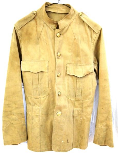 1903 M1898 KHAKI OFFICER'S TUNIC PHILIPPINES MADE: Made in the Philippines in 1903, this is an M1898 tunic with sewn shoulder straps and no lower pockets. Has a full set of buttons. The tunic has some stains and holes, condition is commensurate with a