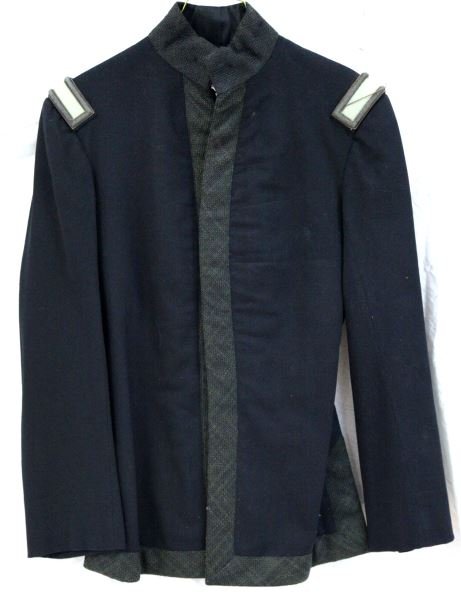 1895 US INFANTRY LIEUTENANT TUNIC: US Infantry Lieutenant uniform tunic from 1895. The shoulder insignia has a fine bullion cord going around it. The coat lining has a small tear, and there are holes on the collar where there would hav