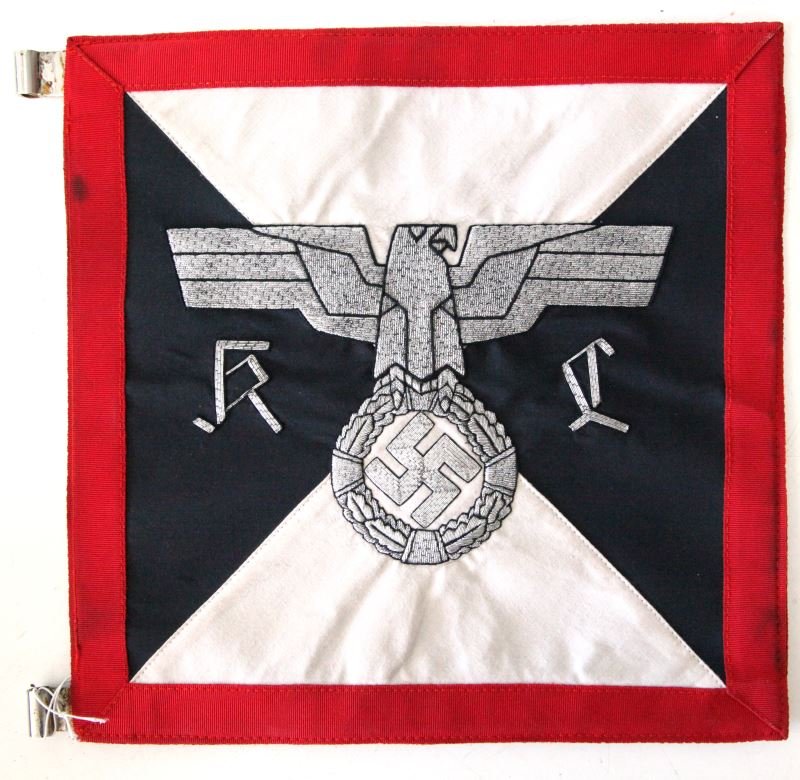 WWII GERMAN REICHSADLER SQUARE AUTO PENNANT: WWII German Reichsadler square auto pennant (reversible). Approximately 11.5 by 11.5 inches red border over metal, connecting to rod holders. Some water staining to white, mild discoloration to border