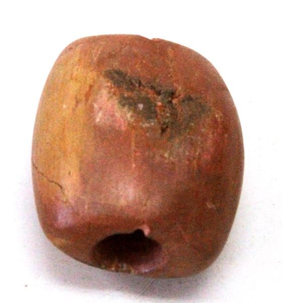 CATLINITE TUBE BANNERSTONE NATIVE AMERICAN: Tube Bannestone made out of Catlinite. Bannerstones where possibly used on the end of spears, but this is currently debated. The item is late Archaic or Early Woodlands. The item has a hairline crack 