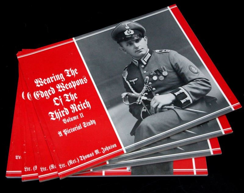 WEARING THE EDGED WEAPONS OF THE THIRD REICH LOT: Wearing The Edged Weapons of the Third Reich, lot of four, by Ltc. Thomas M. Johnson. Three copies of Volume II and one copy of Volume III. Mint condition. This lot has a reserve.