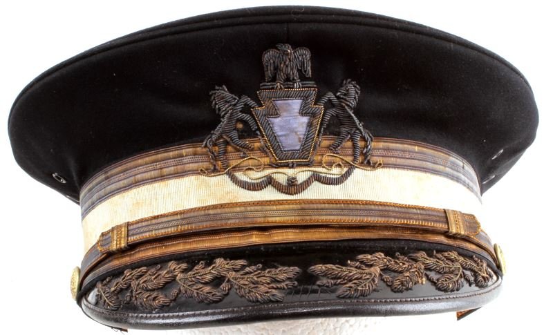 SPANISH AMERICAN WAR PERIOD NGP OFFICERS VISOR HAT: By Jacob Reed's Sons in Philadelphia. Bullion State Militia and scrambled eggs. In very good condition overall with some staining to white band and some stitching loss to sweatband and light alligator