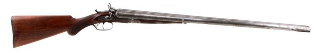 MODEL 1873 REMINGTON & SONS SIDE BY SIDE SHOTGUN: Tip up barrel release. Bead front sight. 29.75 inch barrels. Antique mule ear hammer side by side 12g shotgun. In very good condition with bright bores (needing cleaning). Bridge is marked "E. Remingt