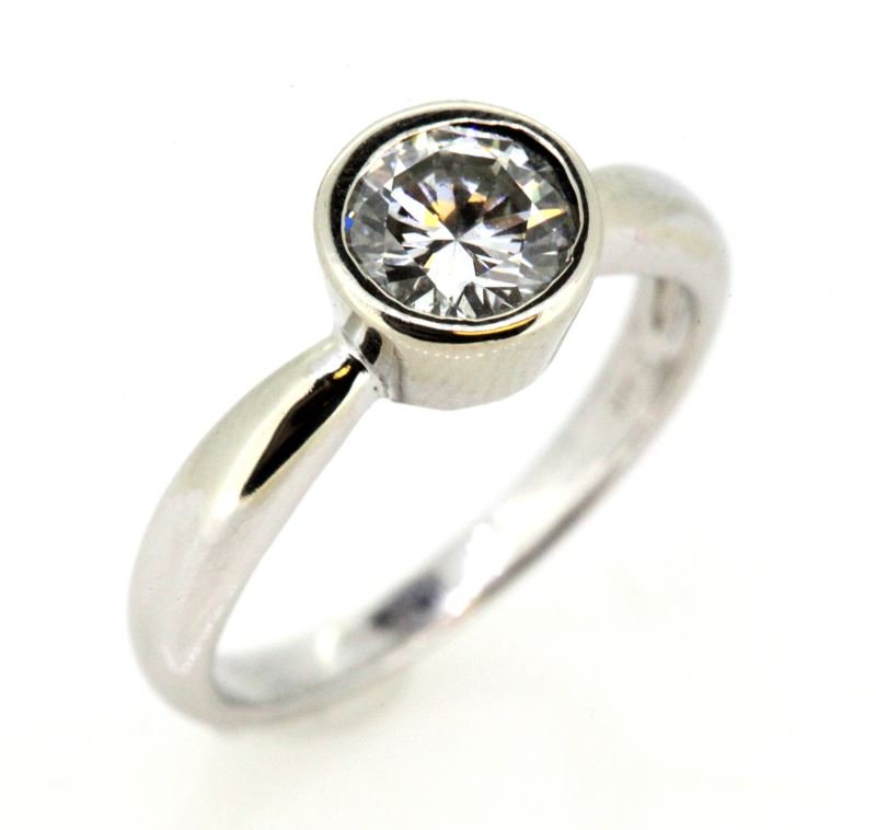 LADIES 14KT WHT GOLD DIAMOND SOLITAIRE RING .71CT: Brand new piece, created by Affiliated Jewelry Division; solitaire engagement ring, 14kt yellow gold split upper shoulders, with white gold tube setting containing one round brilliant cut diamond weig