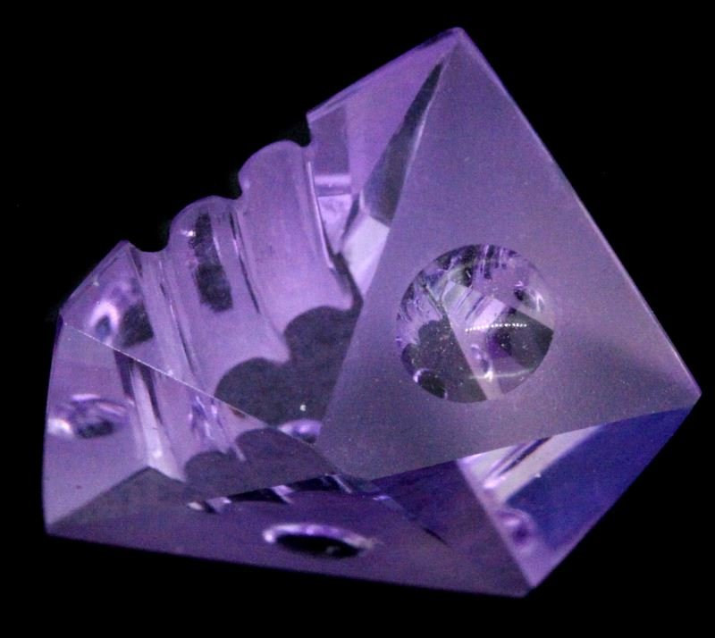 CARVED LOOSE AMTHEYST BY MICHAEL DYBER 11.25 CTS.: Sculpture by Michael Dyber, medium color depth, carved amethyst sculpture, weighing 11.25 carats. In very good condition.