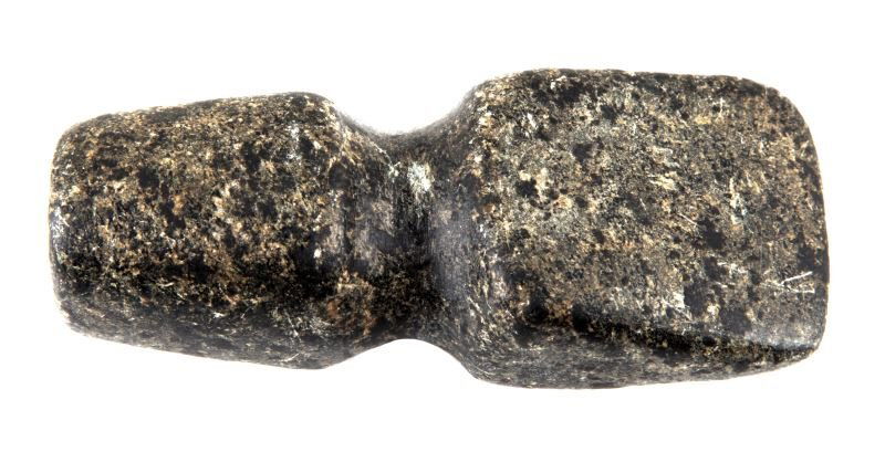 NATIVE AMERICAN STONE STEATITE AXE PIPE: Shaped like a stone axe head, this is a Native American stone pipe. The stone is polished and smooth with natural spotted patterns throughout. The object measures 4.5 inches long and 2 inches at its w