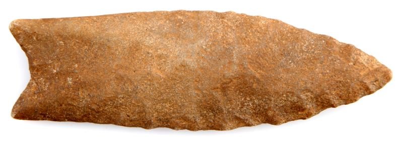 TALLAHATTA QUARTZITE PALEO CLOVIS ARROWHEAD POINT: Paleo Clovis point, Tallahatta quartzite, Marshall county, Alabama. Well worn patina, flute to one side, auriculate base, collateral flaking to one side, more random to other side. Measures 3.5 inches