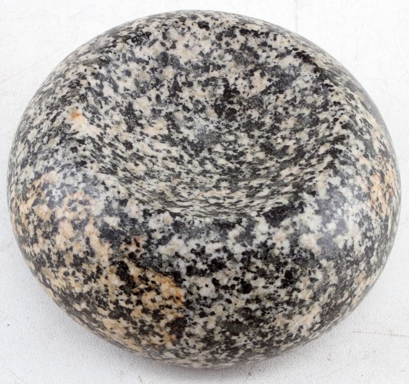NATIVE AMERICAN GAME STONE LARGE DISCOIDAL: Native American game stone discoidal. Smooth surface, cupped to both sides, pebbled granite. Measures 4.5 inches wide and 2.5 inches thick. Very good condition. From private collection of Native Ameri