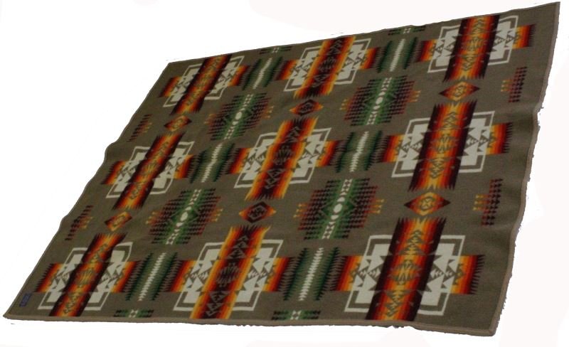 BEAVER STATE PENDLETON WOOL BLANKET 72 BY 58 INCH: Pendleton wool blanket by the Pendleton Woolen Mills from Pendleton, Oregon. The blanket measures 72 by 58 inches and has the "Beaver State" tag. The blanket is multicolored with red, orange, white, a