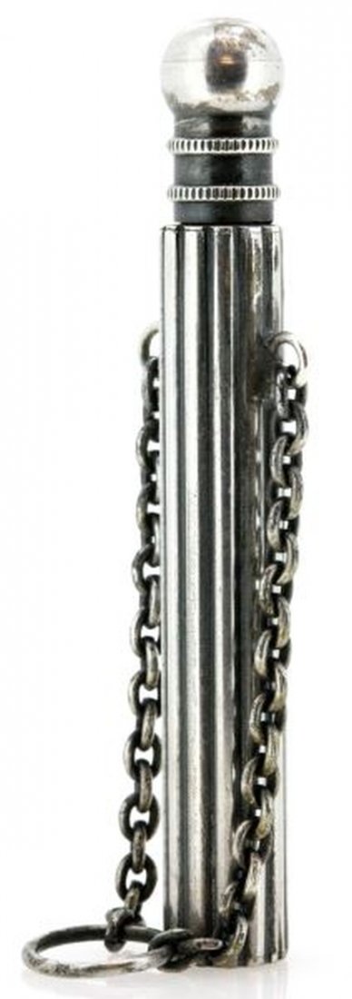 ANTIQUE SILVER PLATE PERFUME BOTTLE 2.75 INCHES: Antique silver plate perfume bottle, likely for a chatelaine. The bottle measures 2.75 inches tall and has a short chain. The bottle is fluted and has a round lid. Overall very good condition.