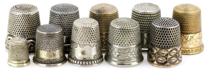 10 ANTIQUE THIMBLES SILVER & GOLD PLATE: Lot of 10 antique thimbles some are unmarked while others were made by the Simon brothers, Waite Thresher, and Ketcham & McDougall. Most of them are marked silver and one appears to be gold fill. They