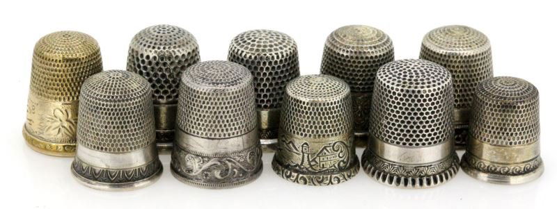 10 ANTIQUE THIMBLES INCLUDING SIMON BROTHERS: Lot of 10 antique thimbles some are unmarked while others were made by the Simon brothers, Ketcham & McDougall and more. Most of them are marked silver and one appears to be gold fill. They are in a v