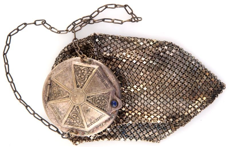 ANTIQUE MANDALAIN ARMOR MESH CYLINDRICAL PURSE: Antique Mandalian armor mesh cylindrical purse. The round top is incised with meanders and floral motifs. There is a blue bead at the clasp. The mesh has traces of blue and green paint. The item is in