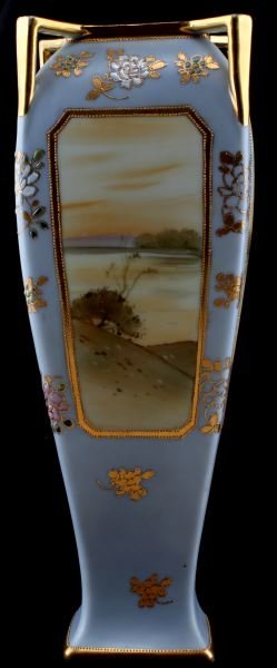 12.5 INCH HAND PAINTED MORIMURA NIPPON VASE: Pre-1921 hand painted porcelain vase by the Morimura company. The vase has a painted landscape scene on each face. Additionally, textured flowers are painted throughout. Golden gilding frames the land