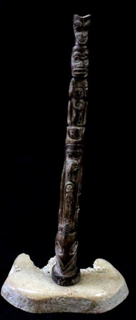 ALASKA FOSSILIZED IVORY HAND CARVED TOTEM POLE: Standing 9.5 inches with stand unsigned circa 1950's, Tlingit themed. 0