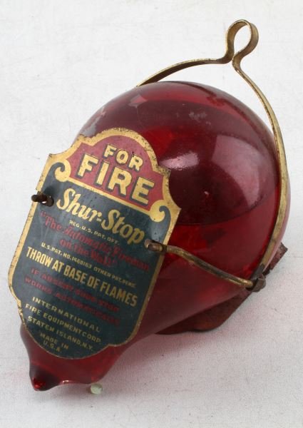 ANTIQUE SHUR-STOP FOR FIRE EXTINGUISHER: "The Automatic Fireman on the Wall", antique fire extinguisher. For Fire Shur-Stop. The item still has fire extinguishing fluids inside. The red covered on the glass has some chipping, but overall ver