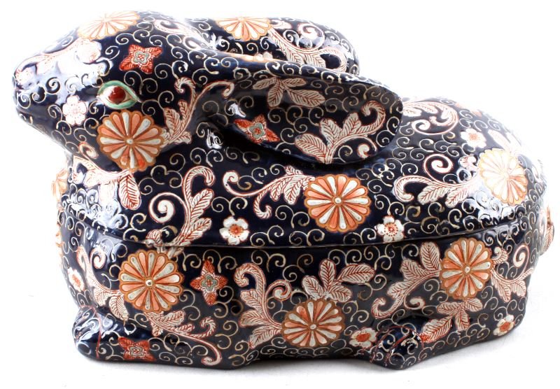 SPANISH EARTHENWARE BUNNY RABBIT DUTCH OVEN RELIEF: Spanish earthenware Dutch oven, rabbit shape, hand-painted floral design, low relief. Dark blue background with colors of cream, orange, red and light blue. Marked with small blue "t" to interior. Ver