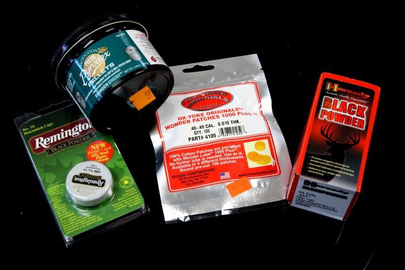 BLACK POWDER SHOOTING ACCESORIES: All items new and unused, Remington percussion caps, Ox-Yoke 1000 plus patches, 100 .44 caliber balls, and 44/45 propellant pellets. 0