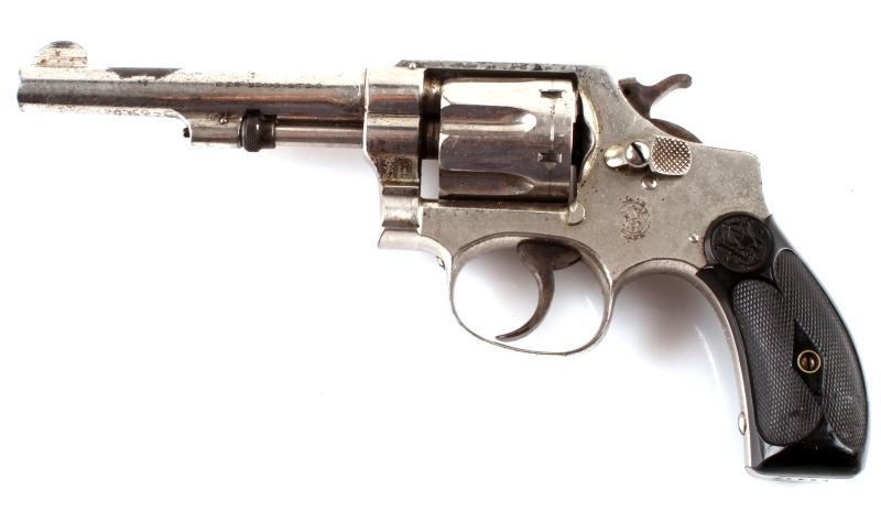 SMITH & WESSON 32 LONG COLT REVOLVER MODEL 1917: 1917 Smith & Wesson .32 caliber long revolver, 6 shot, 4 inch barrel. Bore is bright but dusty. Nickel plated, about 50%, much loss from holster and/or storage. Has polymer grips (one with crack). Dri