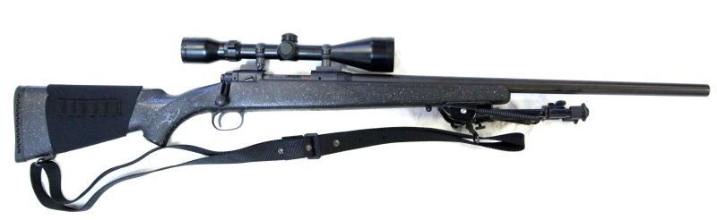 SAVAGE MODEL 10 RIFLE W SCOPE & BIPOD IN .223 REM.: Black weighted parkerized 24 inch barrel, BSA Catseye 3.5 - 10 X 50 scope. Savage "Tactic" bolt, Nylon stock, Sling, recoil pad, shell band and adjustable bipod rest. Very good to Excellent condition.