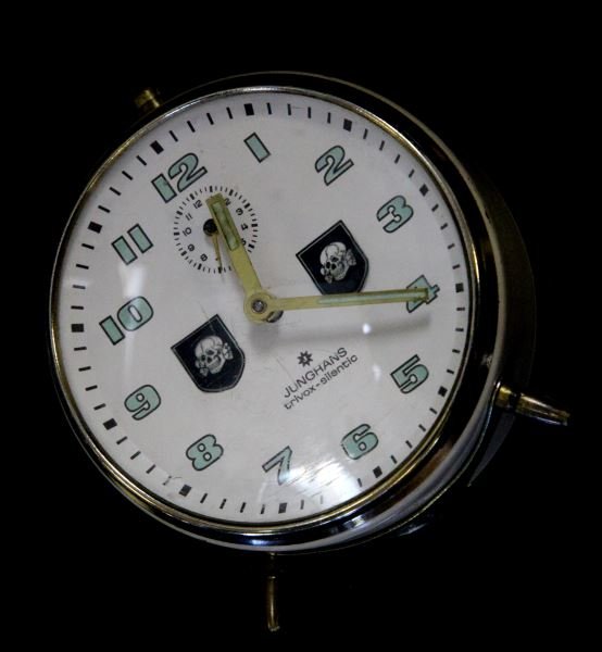 GERMAN THIRD REICH WAFFEN SS ALARM CLOCK: Some loss of finish and scratches present to alarm clock; overall in very good condition. Unauthenticated as is. This lot has a reserve