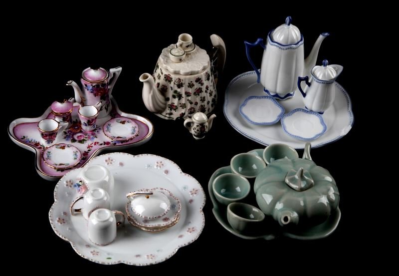 LOT OF FIVE PORCELAIN TEA SETS LIMOGES PORTMEIRION: Lot of five different porcelain tea sets including Limoges. Some of the tea sets are missing pieces but they are in overall very good condition. The blue and white tea set's tray has a chip along the