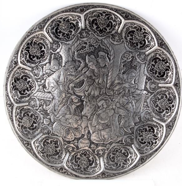 LARGE METAL ISLAMIC MIDDLE EASTERN WALL PLATTER: 19 inch diameter platter with medium relief musical dance scene motif. All hand tooled. hanging loop on back. In very good condition.