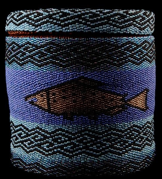 BEADED PAIUTE FIGURAL LIDDED BASKET 6.5 INCH TALL: Beaded and woven basket made by the Paiute tribe. The basket has geometric decorations and fish. High quality craftsmanship. Very good condition. 6.5 inches tall with a 5 inch rim diameter.