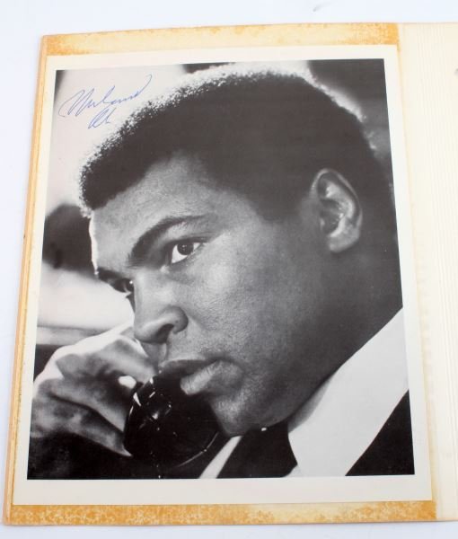 MUHAMMAD ALI SIGNED PHOTOGRAPH: Singed photo of Muhammad Ali, does not have a COA but guaranteed authentic. Photo is attached to old binder paper and on reverse is picture of Elroy Hirsch "Crazy Leggs". Both picture are 10 by 8 inch