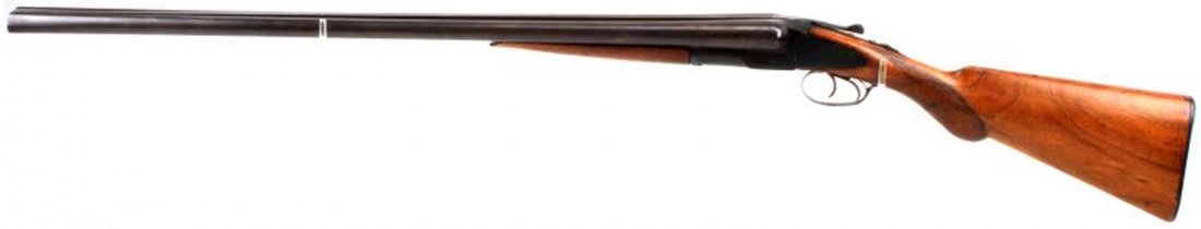 HUNTER ARMS L.C. SMITH 12 GA.DOUBLE BARREL SHOTGUN: 30 inch barrels marked "Armor Steel" & "Hunter Arms Co. Makers, Fulton, N.Y. . Bowed bridge with bead sight muzzle end. Thumb safety on tang. 80% bluing remains. Overall very good condition. This gun 