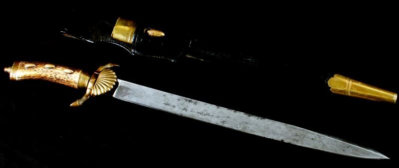 IMPERIAL GERMAN JA HENCKELS HIRSCHFANGER W FROG: Imperial German hirschfänger (hunting dagger) with scabbard and frog. Blade is in very good condition, measures 16 inches, contains ornate hunting scenes etched onto the surface, and only shows very 