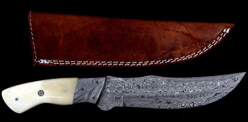 DAMASCUS STEEL & POLISHED DEER BONE HUNTING KNIFE: Damascus steel hunting knife with polished deer bone handle. Rain drop patterned blade with steel rivet construction. Measures 10.25 inches long. Made in Virginia Beach. Comes with leather sheath. Goo