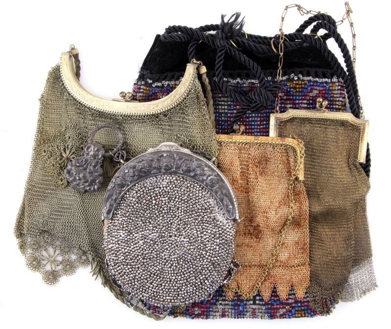 LOT OF FIVE ANTIQUE PURSES INCLUDING MESH BAGS: Antique mesh and beaded purses. Lot includes three mesh purses. The first mesh purse has an orange tone, the frame has floral designs, made in Germany. The second mesh purse is a Whiting and Davis mes