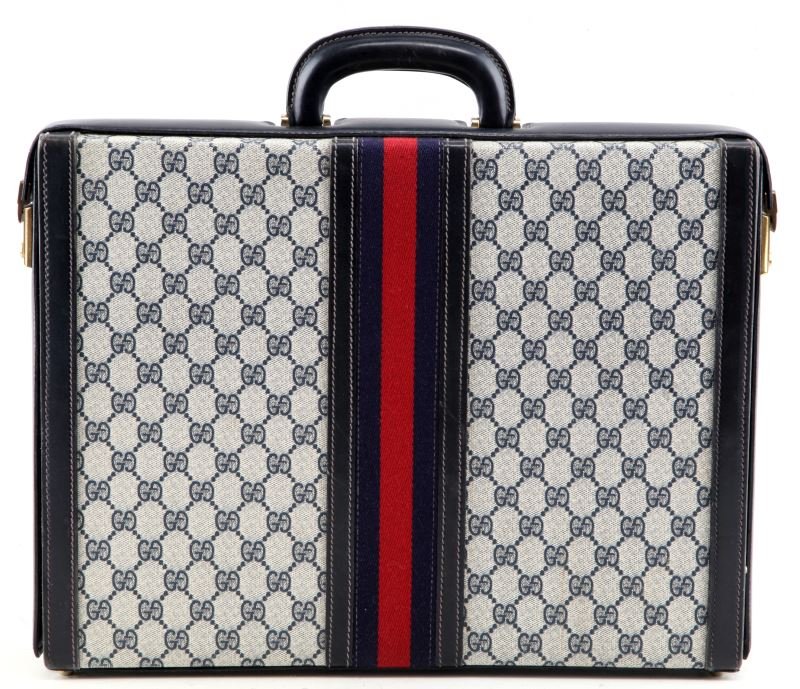 VINTAGE NAVY BLUE GUCCI MONOGRAM CANVAS BRIEFCASE: Vintage Gucci monogram red and blue stripe briefcase, opens to reveal a divided compartment at one side, includes keys. Briefcase has light yellow stain on canvas and few pencil marks inside, some lig