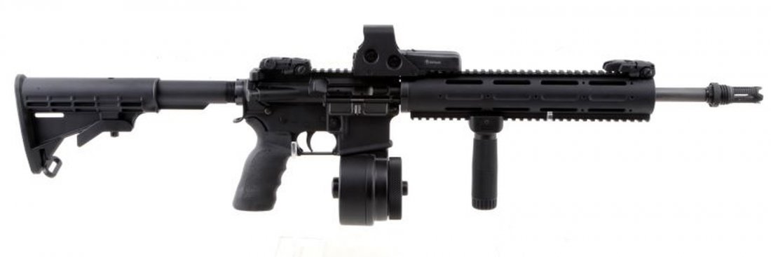 AD-TEK OF TALLAHASSEE TIMBERWOLF .223 CAL AR-15: Ad-Tek of Tallahassee Timberwolf .223 caliber AR-15. Sig Sauer fore grip installed. EOTech sight installed. MBUS front sight installed. Tapco stock. Comes with one fifty round drum magazine. Overall v