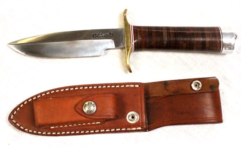 RANDALL CC 5 INCH KNIFE WITH LEATHER SHEATH: Randall knife with leather sheath. 5 inch blade in excellent condition. "RANDALL MADE ORLANDO, FLA." appears on base of blade near hand guard. Wood handle. Sheath has compartment that contains whet st