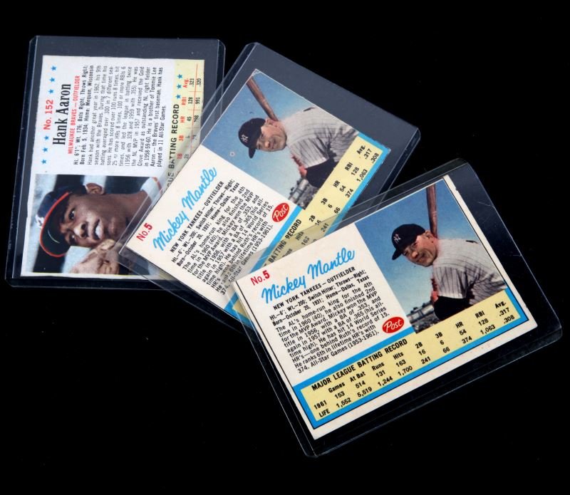 LOT OF 3 VINTAGE BASEBALL CARDS MANTLE AARON: Lot of 3 vintage baseball cards, Post Cereal and Jello. This lot includes two Mickey Mantle number 5 Post cards, 3-5 grade. The Hank Aaron card is a Jell-O card, this card would have been cut out from